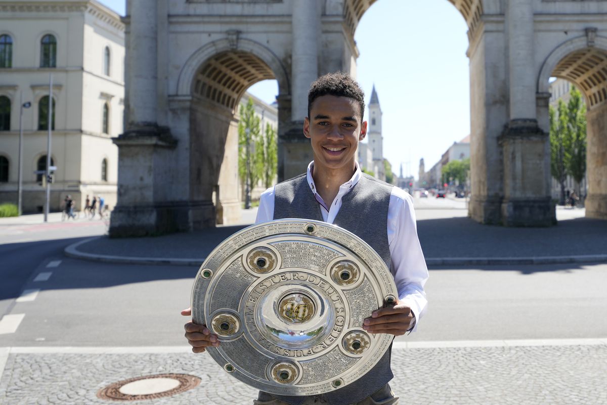 Jamal Musiala Hands Over Bundesliga Trophy To FC Bayern Museum