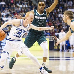 Brigham Young guard TJ Haws (30) tries to get past Utah Valley guard Conner Toolson (11) during an NCAA college basketball game in Provo on Saturday, Nov. 26, 2016. Utah Valley was 18 of 37 from beyond the arc en route to a 114-101 ousting of Brigham Young.