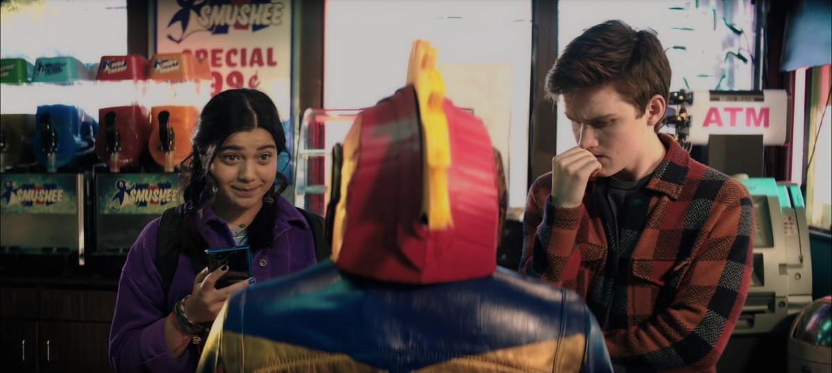 Kamala Khan and a friend look at a Captain Marvel outfit in a sizzle reel for Marvel’s Ms. Marvel.