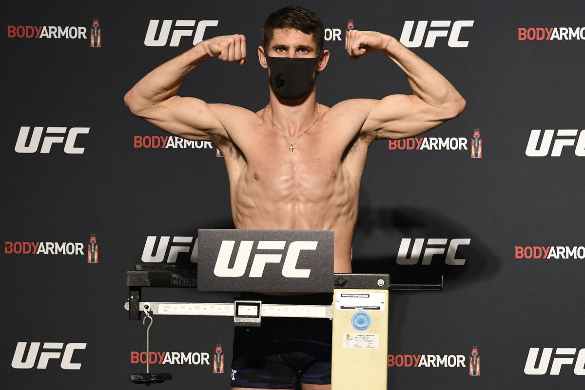 Charles Rosa poses on the scale during the UFC 249 official weigh-in on May 08, 2020 in Jacksonville, Florida.