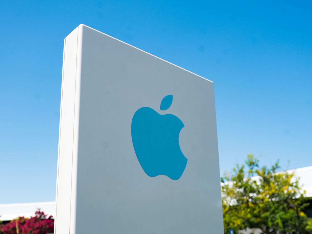 A sign outside of one of Apple’s offices in Silicon Valley is a white square with a blue Apple logo.