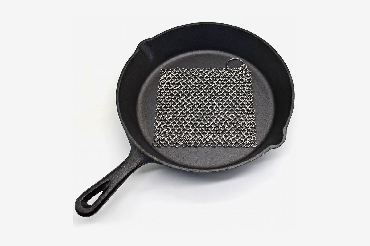 A cast-iron skillet with a square of chainmail