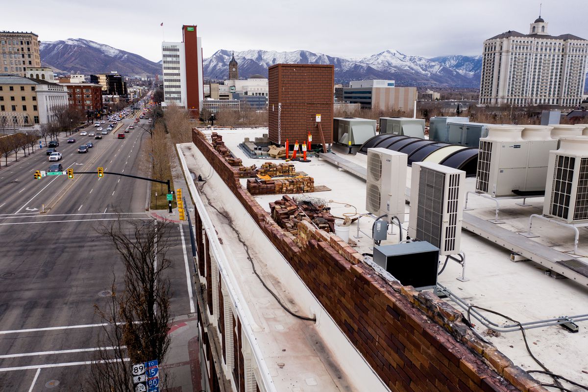 Nearly a year after a magnitude 5.7 earthquake rattled the Wasatch Front, bricks are stacked near a damaged wall on the roof of the Eagles Building, home of Caffé Molise and BTG Wine Bar, in Salt Lake City on Tuesday, March 9, 2021.