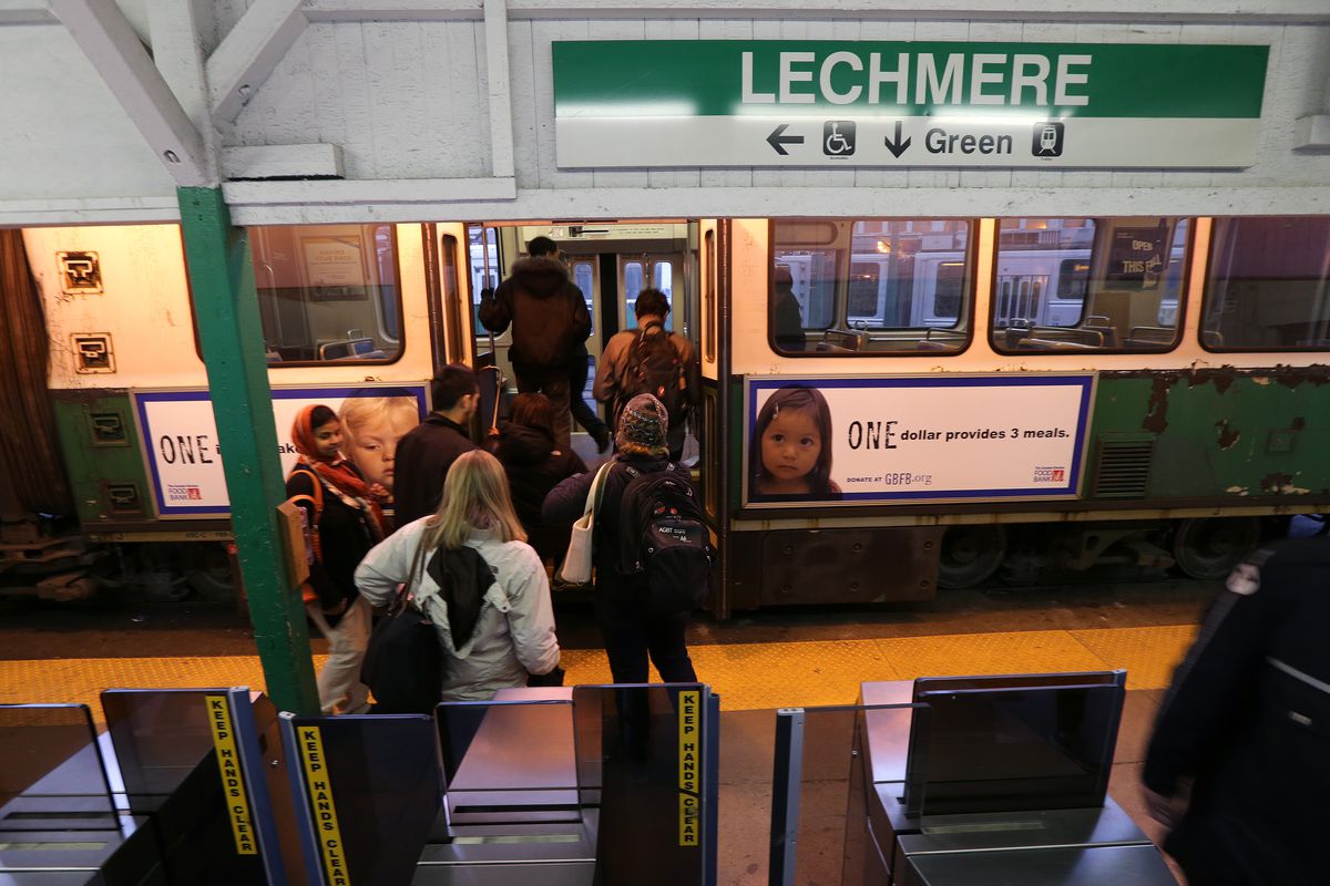 People boarding a subway trolley.