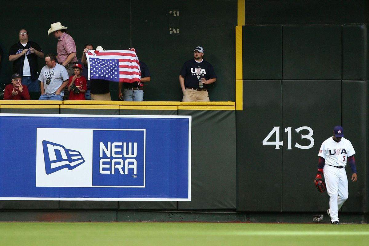 A fan holds the flag upside down in the stands during the USA/Canada game on March 8, 2006 at Chase Field.