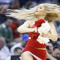 A Utah Utes cheerleader performs during the NCAA Tournament in Denver on Thursday, March 17, 2016. Utah won 80-69. 