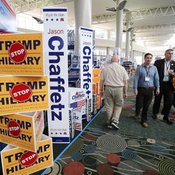 Attendees walk through candidate displays during the Utah State Republican Convention at the Salt Palace in Salt Lake City on Saturday, April 23, 2016.