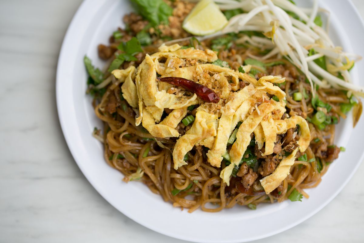 Kua mee, stir-fried rice noodles with ground pork, egg omelette, and crushed peanuts