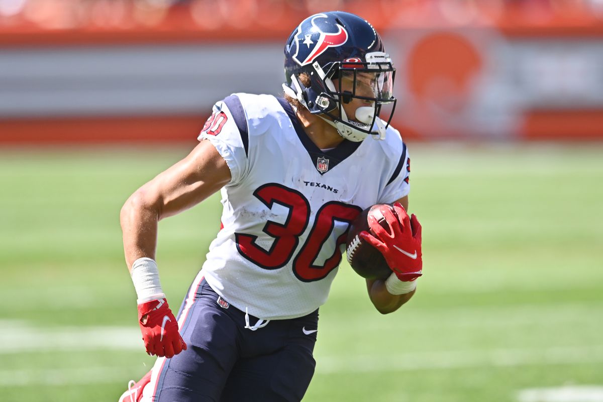 Houston Texans running back Phillip Lindsay (30) runs with the ball en route to a touchdown during the first half against the Cleveland Browns at FirstEnergy Stadium.