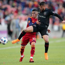 D.C. United midfielder Ulises Segura (8) cuts off Real Salt Lake midfielder Pablo Ruiz (31) as the two battle for the ball as Real Salt Lake and D.C. United play an MLS Soccer match at Rio Tinto Stadium in Sandy on Saturday, May 12, 2018.