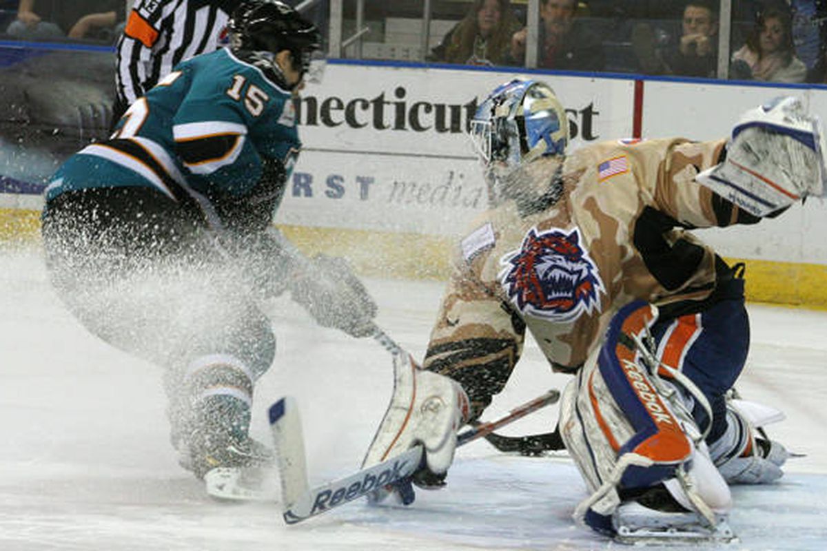 Worcester Sharks forward James Sheppard beats Sound Tigers goaltender Kevin Poulin during the shootout Saturday night at the Webster Bank Arena.