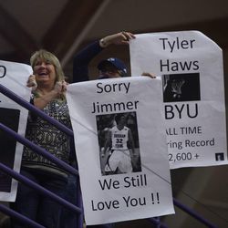 Fans hold up signs after Tyler Haws passed Jimmer Fredette as BYU's all-time leading scorer Thursday, Feb. 26, 2015, in the Cougars' game against the University of Portland at the Chiles Center.