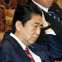 Japanese Prime Minister Shinzo Abe listens to questions during a special committee on the Trans-Pacific Partnership (TPP) at the parliament's upper house in Tokyo Friday, Dec. 9, 2016. Abe won parliamentary approval Friday for ratification of the TPP, despite U.S. President-elect Donald Trump's plan to withdraw from the 12-nation trade pact. Upper house lawmakers approved the TPP, heeding Abe's calls to push ahead with it despite Trump's rejection of the free-trade initiative championed by President Barack Obama. 