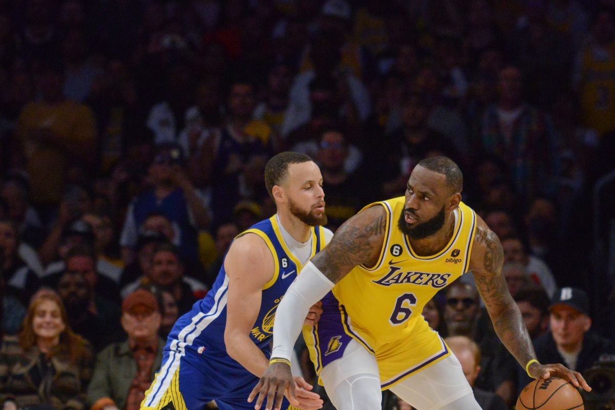 LeBron James backing down Steph Curry