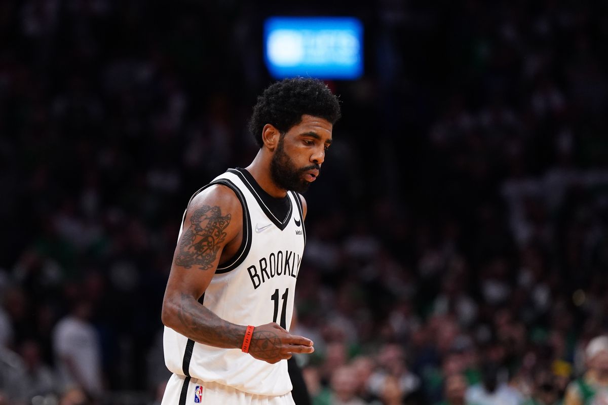 Brooklyn Nets guard Kyrie Irving (11) reacts after his basket against the Boston Celtics in the second half during game one of the first round for the 2022 NBA playoffs at TD Garden.