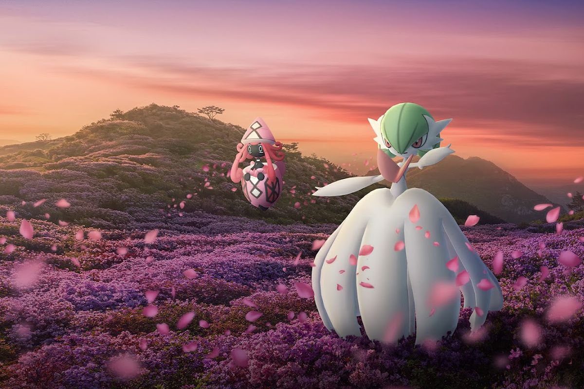 Mega Gardevoir and Tapu Lele stand in a field of flowers at sundown