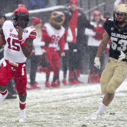 Utah Utes quarterback Jason Shelley (15) sweeps around the end for a big gain during the University of Utah football game against the University of Colorado at Folsom Field in Boulder, Colorado, on Saturday, Nov. 17, 2018.