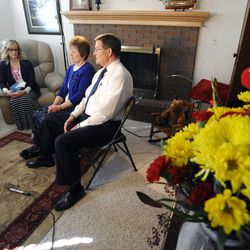 Kathy and Blake Wride, parents of fallen Utah County Sgt. Cory Wride, and Anne Curtis, Cory's sister, share some memories and talk about the kind of person Cory was at their home on Sunday, February 2, 2014.