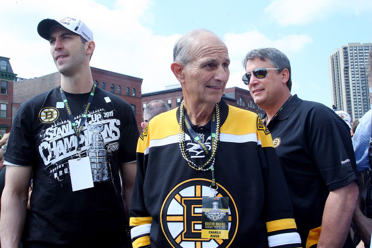 BOSTON, MA  - JUNE 18: (L-R) Zdeno Chara, Jeremy Jacobs, and Cam Neely, of the Boston Bruins react to cheers during the Stanley Cup victory parade on June 18, 2011 in Boston, Massachusetts.  (Photo by Jim Rogash/Getty Images)