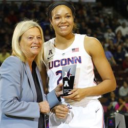 UConn’s Napheesa Collier poses with Barbara Jacobs from the American Athletic Conference with her All-AAC First Team trophy.