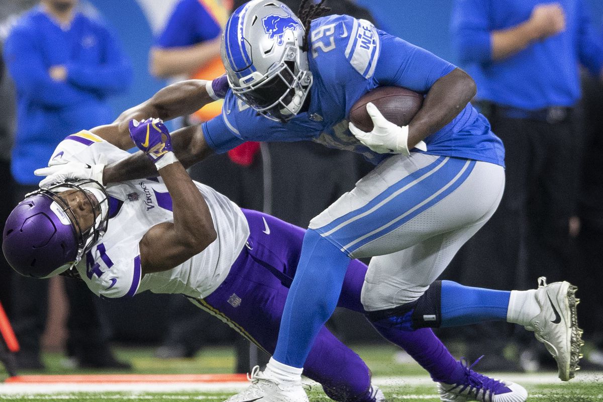 Detroit Lions running back LeGarrette Blount (29) stiff armed Minnesota Vikings defensive back Anthony Harris (41) for a first down in the forth quarter at Ford Field Sunday December 23, 2018 in Detroit, MI.] The Minnesota Vikings beat the Detroit Lions