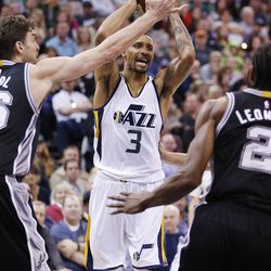 Utah Jazz guard George Hill (3) drives on San Antonio Spurs center Pau Gasol (16) during NBA action in Salt Lake City on Friday, Nov. 4, 2016. The Spurs won 100-86.