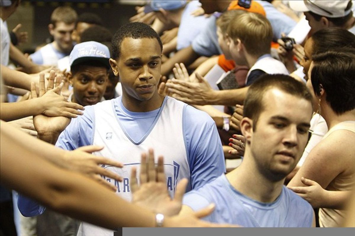 John Henson  is greeted by fans before practice at Greensboro Coliseum.  