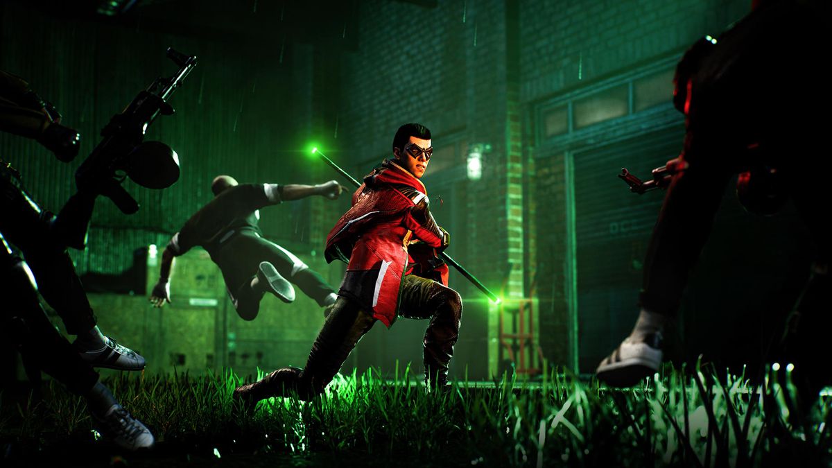 Robin wields a staff while facing off against enemies in a courtyard in Gotham Knights.