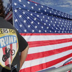 A supporter of President Donald Trump waits in line hours before the arena doors open for a campaign rally Tuesday, June 18, 2019, in Orlando, Fla. (AP Photo/John Raoux)