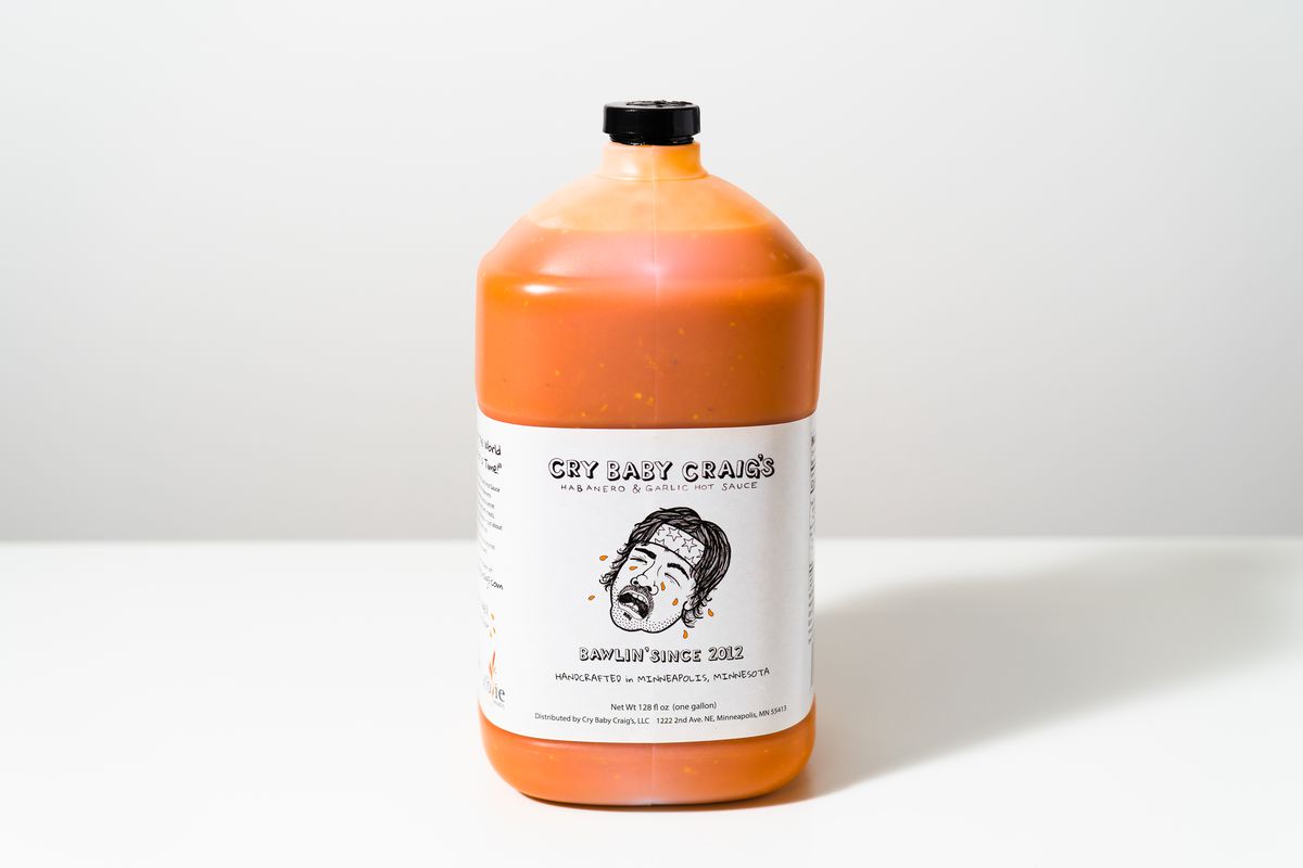 A gallon jug of hot sauce