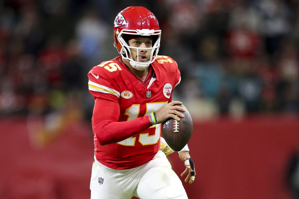 Kansas City Chiefs quarterback Patrick Mahomes (15) runs with the ball against the Miami Dolphins in the second quarter during an NFL International Series game at Deutsche Bank Park.
