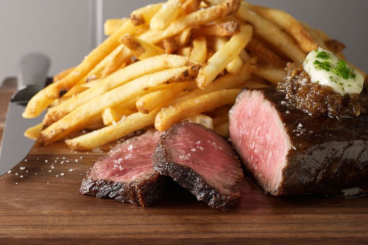 steak and French fries on a plate.