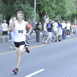 Dallin Taylor runs the Deseret News 10K race that started in Research Park and ended in Liberty Park in Salt Lake City Saturday.