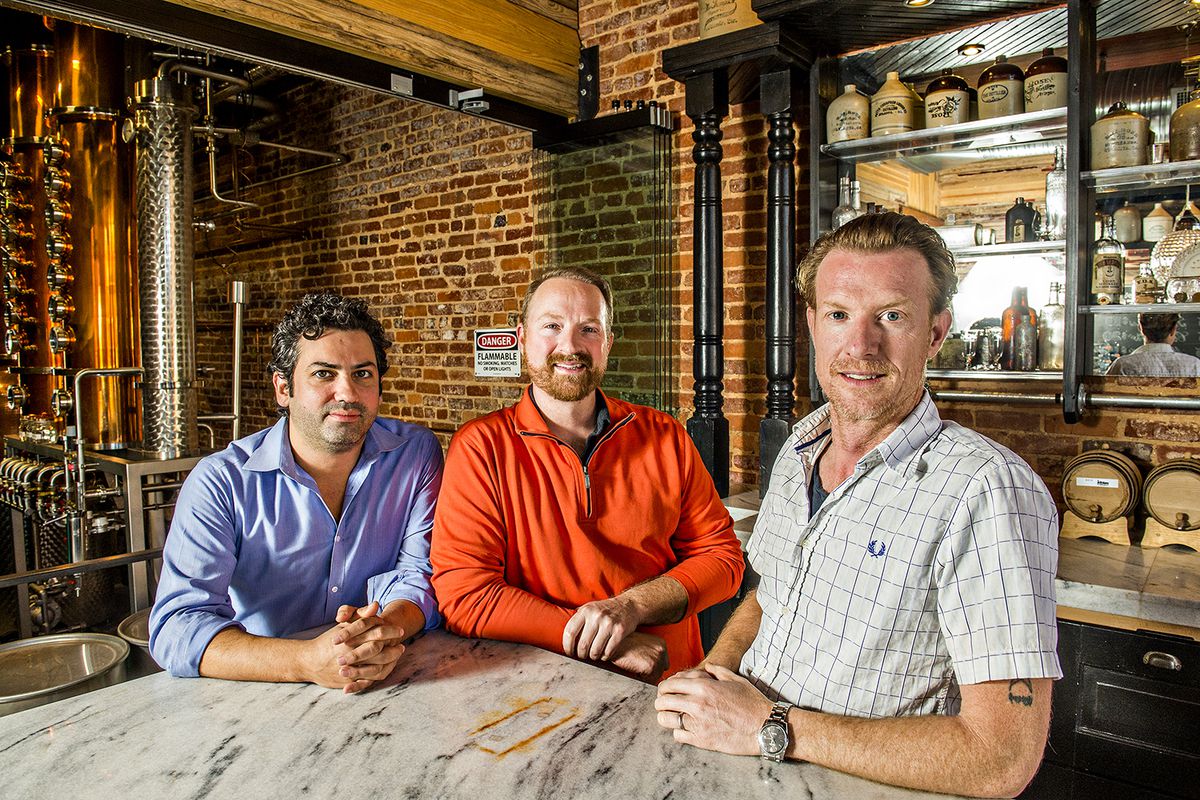 Gabe Pilato (left), Craig Moore (center), and his brother Jeff are the brains, brawn, and faces behind Old 4th Distillery.