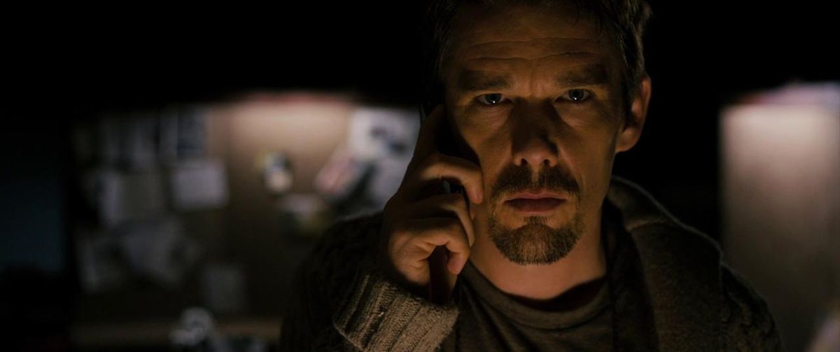Ethan Hawke is very serious and on the phone in Sinister.