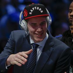 Jakob Poeltl answers questions during an interview after being selected ninth overall by the Toronto Raptors during the NBA basketball draft, Thursday, June 23, 2016, in New York.