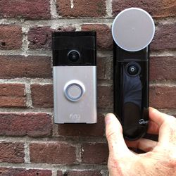 <em>Ring’s first generation doorbell vs. the new Arbor.</em>