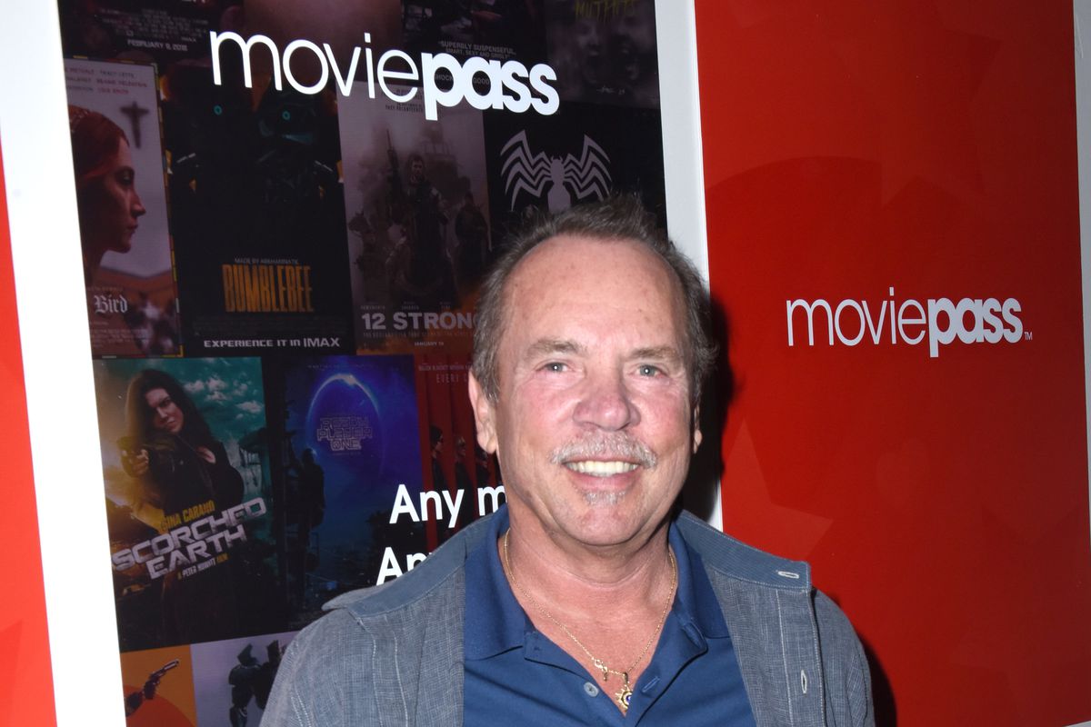 CEO Mitch Lowe in front of a sign that says MoviePass