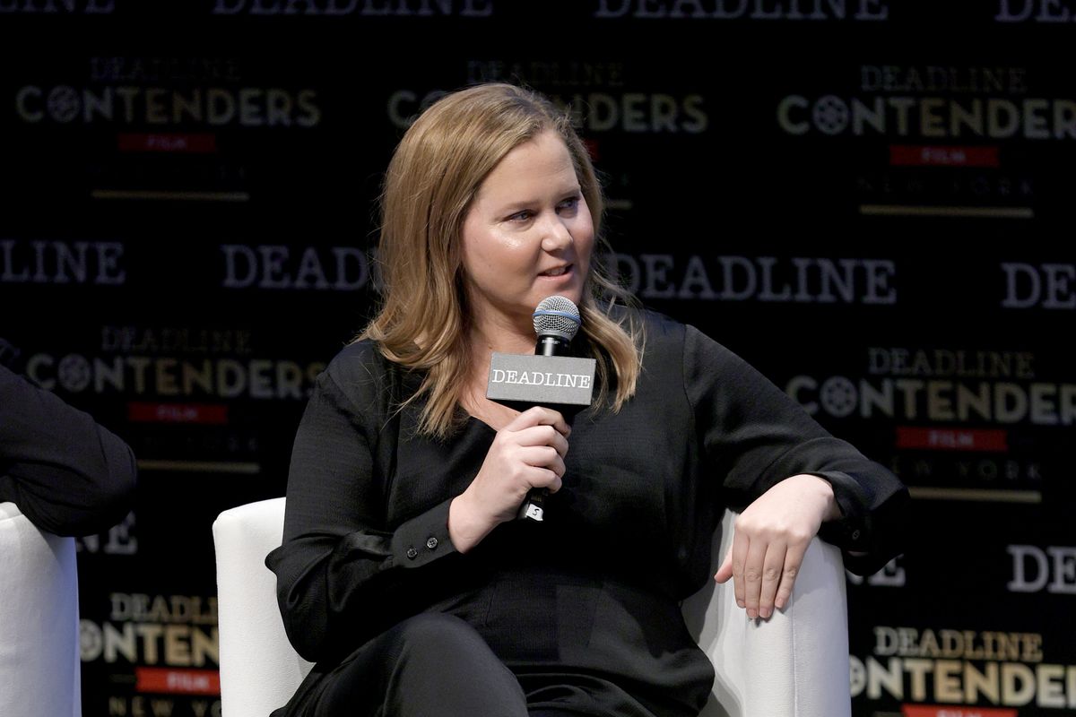 Actor Amy Schumer speaks onstage during A24’s “The Humans” panel during Deadline Contenders Film: New York on December 04, 2021 in New York City.