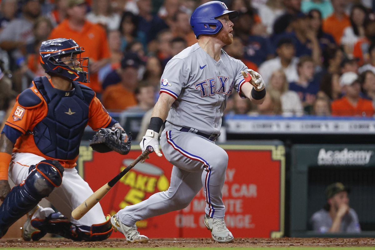 Rangers right fielder Kole Calhoun (56) hits a home run during the fourth inning against the Houston Astros at Minute Maid Park.