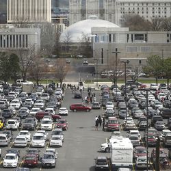 Conferencegoers park and walk to the Conference Center for the Sunday afternoon session of the 189th Annual General Conference of The Church of Jesus Christ of Latter-day Saints in Salt Lake City on Sunday, April 7, 2019.