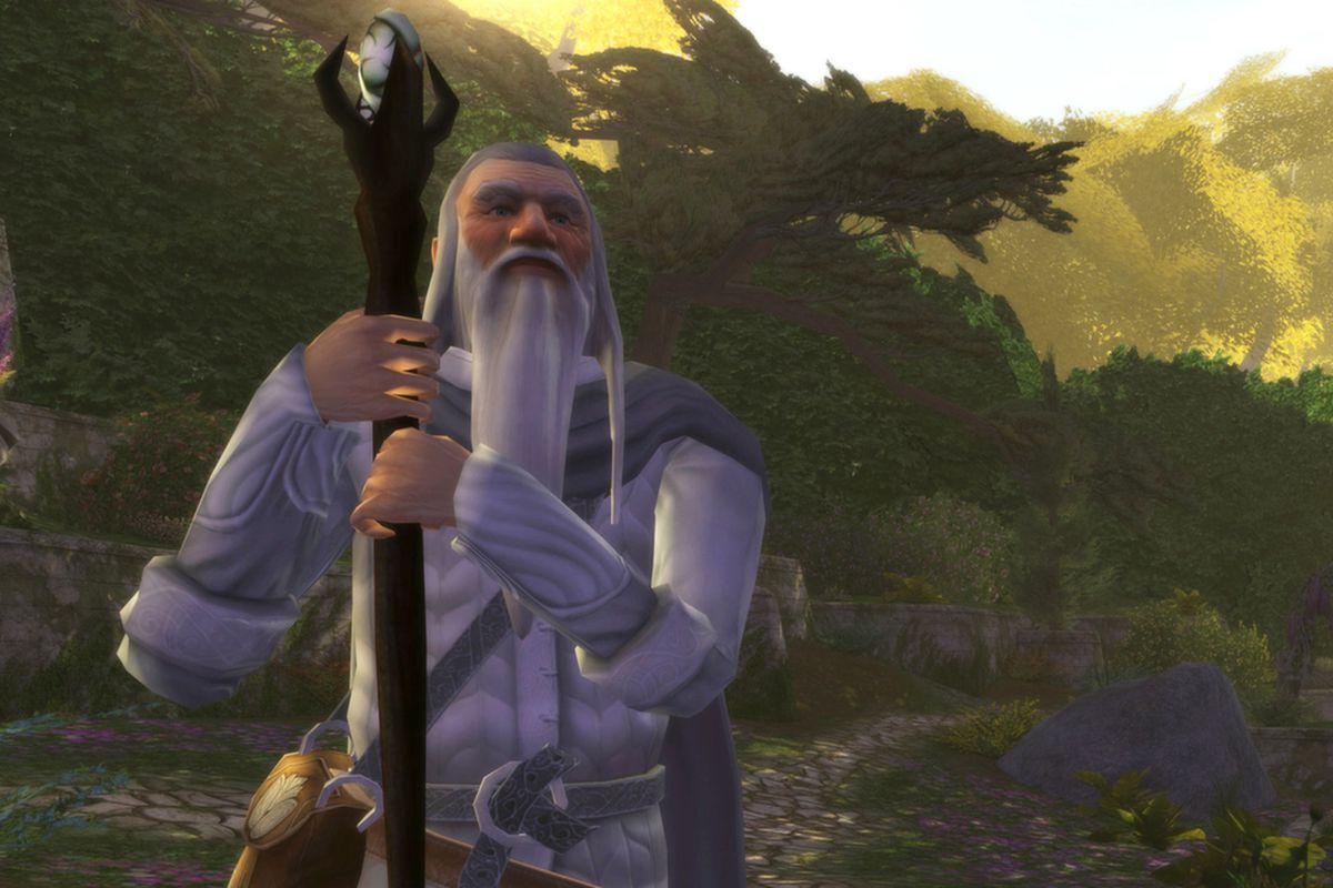 A wizard character leans on his staff in Lord of the Rings Online