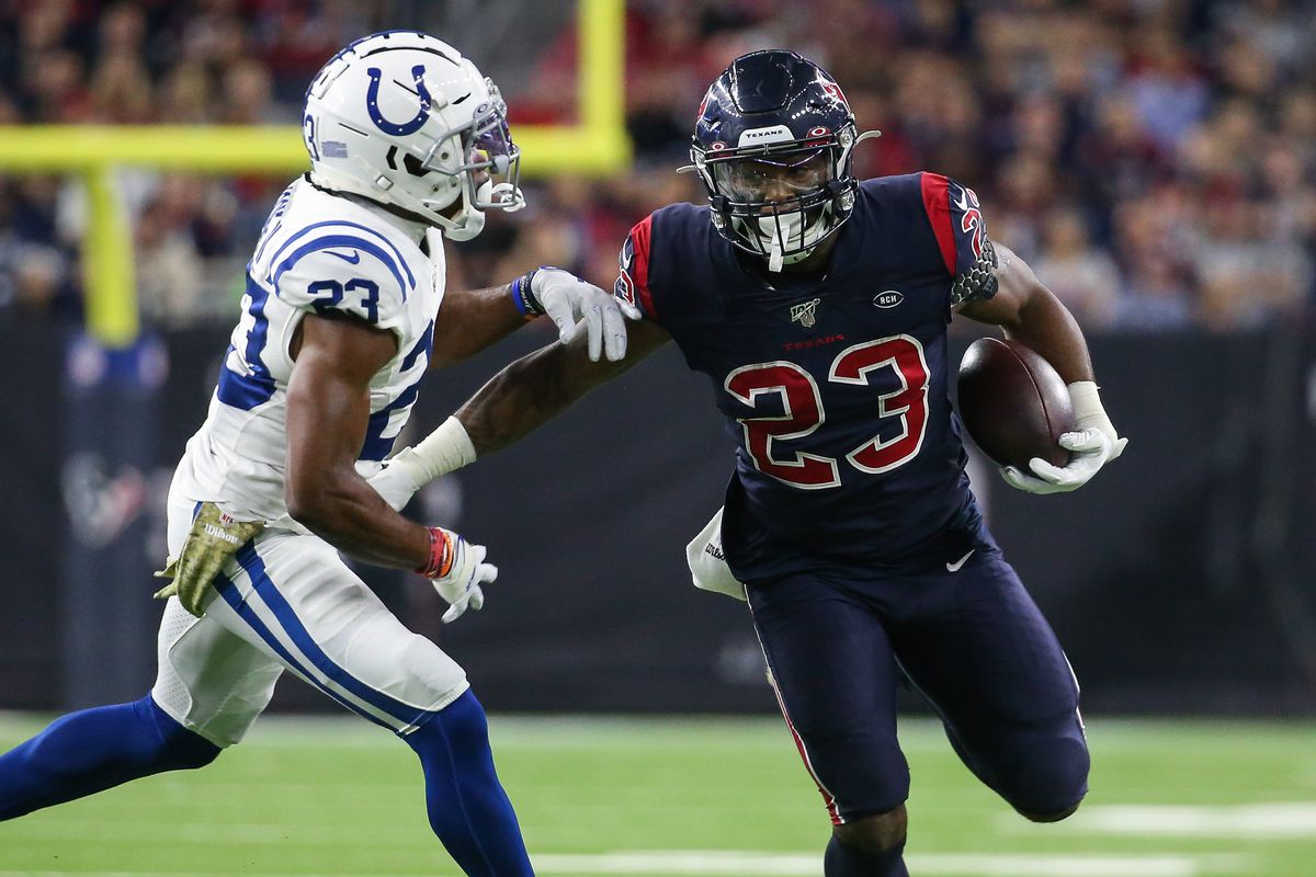 &nbsp;Houston Texans running back Carlos Hyde runs with the ball as Indianapolis Colts cornerback Kenny Moore (23) defends during the game at NRG Stadium.&nbsp;