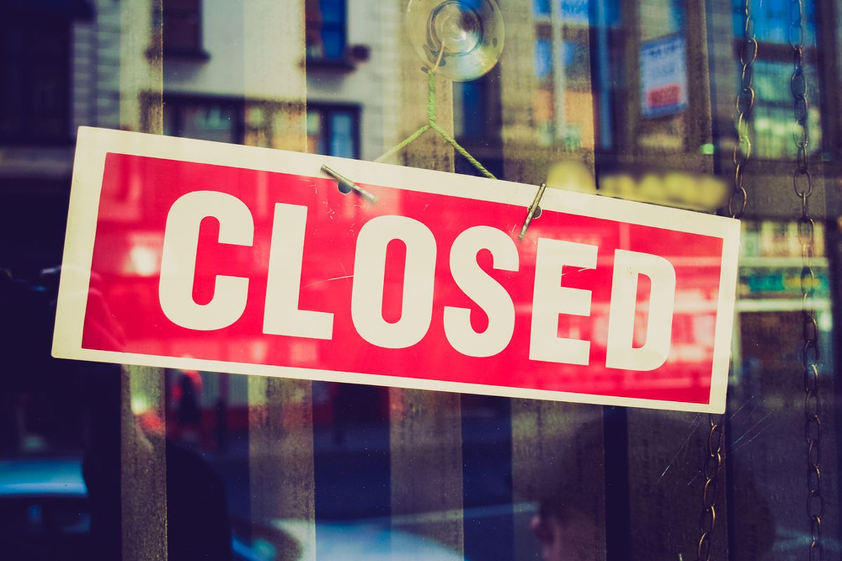 Stock photograph of a closed sign in a window