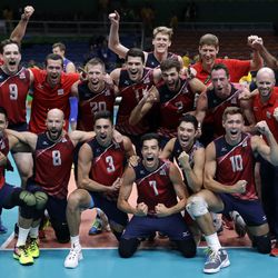 Members of the United States team celebrate after defeating Russia in the men's bronze medal volleyball match at the 2016 Summer Olympics in Rio de Janeiro, Brazil, Sunday, Aug. 21, 2016.