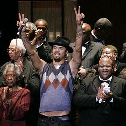 Michael Franti sings with the Calvary Baptist Church Gospel Choir as part of "Raise the Roof! A Celebration of Diversity," at the Capitol Theater Wednesday. The audience roared for Franti, singing, dancing and clapping along.