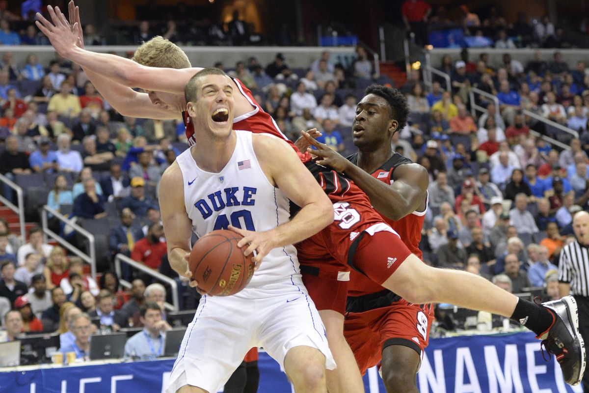 Mar 9, 2016; Washington, DC, USA; Duke Blue Devils center Marshall Plumlee (40) looks to shoot as he is fouled by North Carolina State Wolfpack guard Maverick Rowan (24) in the first half during day two of the ACC conference tournament at Verizon Cen