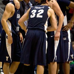 Jimmer Fredette (32) of the Brigham Young Cougars celebrates with teammates and coach Dave Rose against the San Diego State Aztecs during the second half at Cox Arena on February 26, 2011 in San Diego, California. BYU beat SDSU 80-67.
