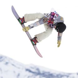 Jessika Jenson of the United States takes a jump during the women's snowboard slopestyle semifinal at the 2014 Winter Olympics, Sunday, Feb. 9, 2014, in Krasnaya Polyana, Russia.
