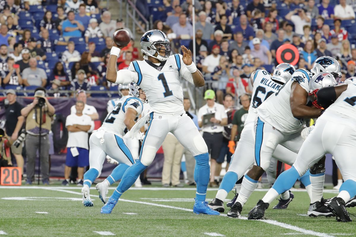 Carolina Panthers quarterback Cam Newton passes the ball during a preseason game between the New England Patriots and the Carolina Panthers on August 22, 2019, at Gillette Stadium in Foxborough, Massachusetts.